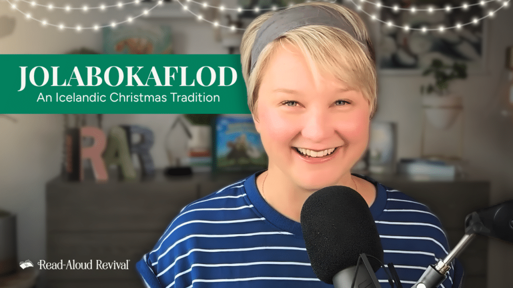 Smiling presenter speaking into a microphone with a green Jolabokaflod banner reading 'An Icelandic Christmas Tradition' for Read-Aloud Revival.