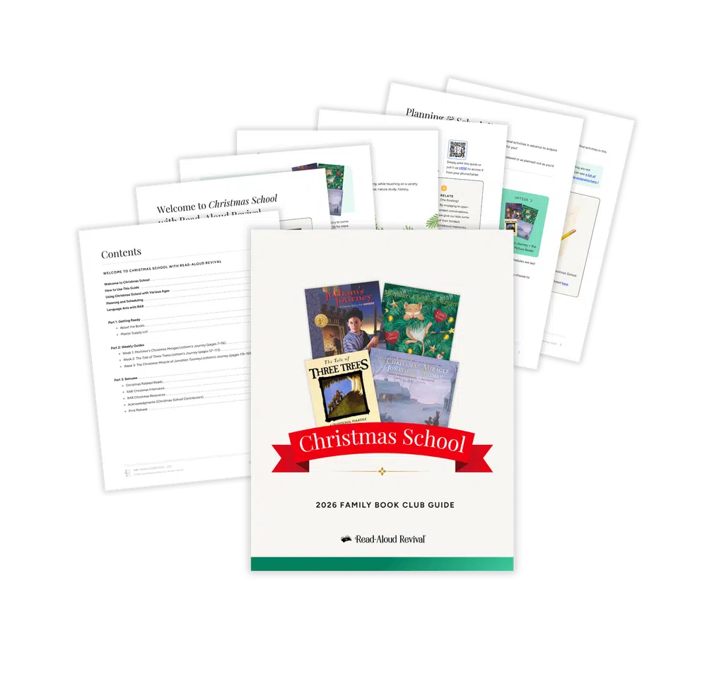 Christmas Mockup - Read-Aloud Revival ® with Sarah Mackenzie Front cover of a 2026 Family Book Club Guide titled 'Christmas School' with colorful book images and a red ribbon, laid over fanned white pages against a black background.